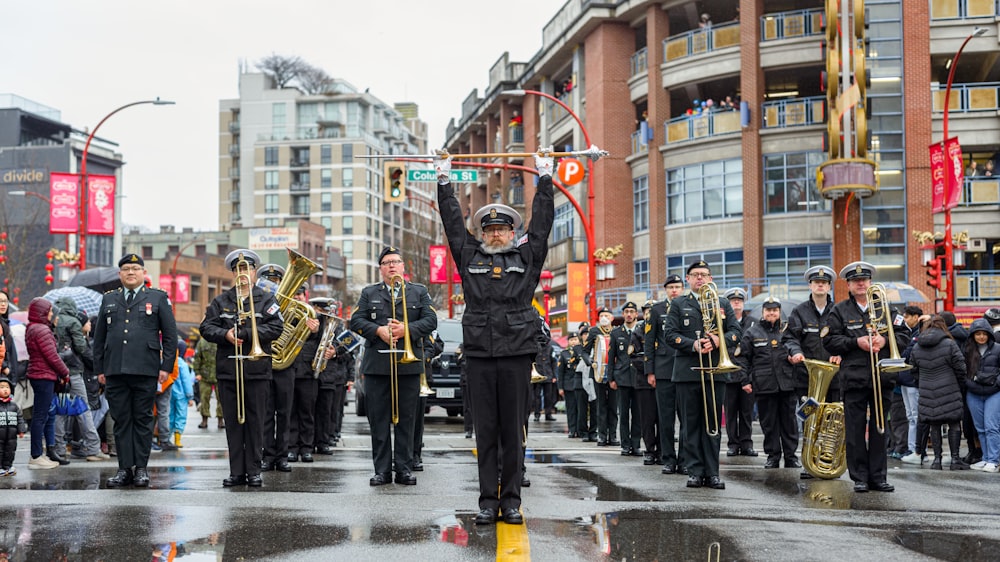 a marching band marching down a city street