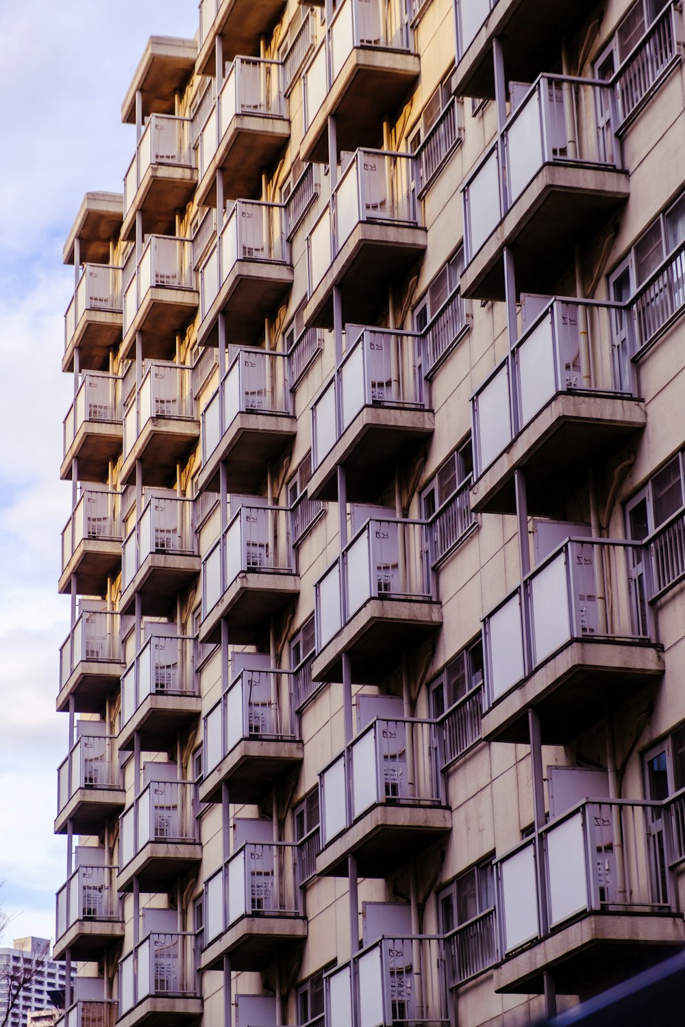 a tall building with balconies and balconies on each floor