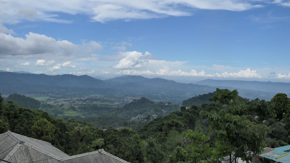 a view of the mountains from a hill top