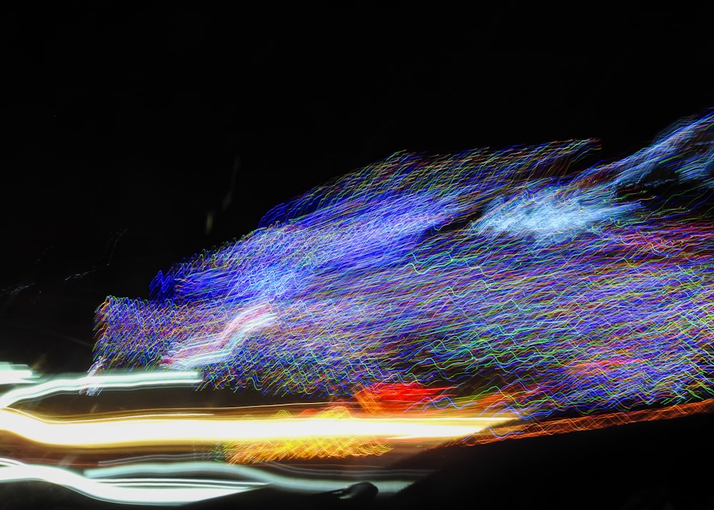 a blurry photo of a street at night