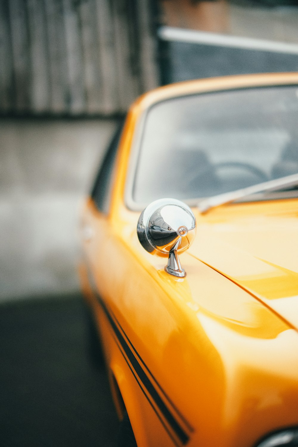 a close up of a yellow car door handle