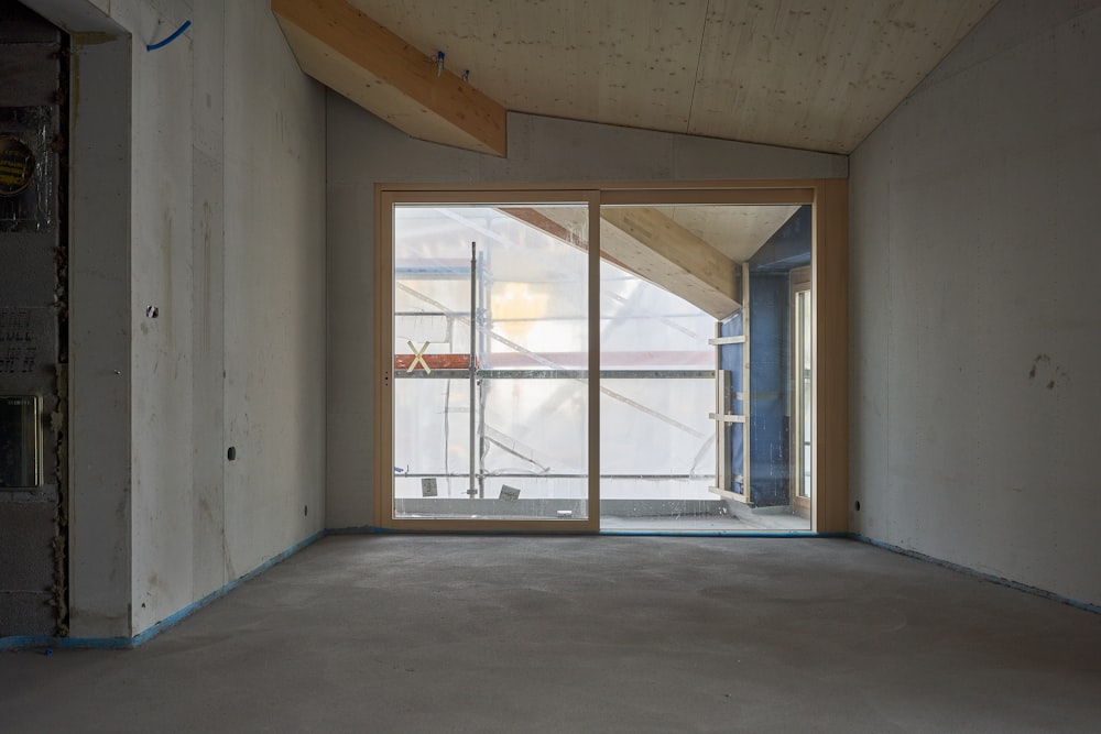 an empty room with a sliding glass door