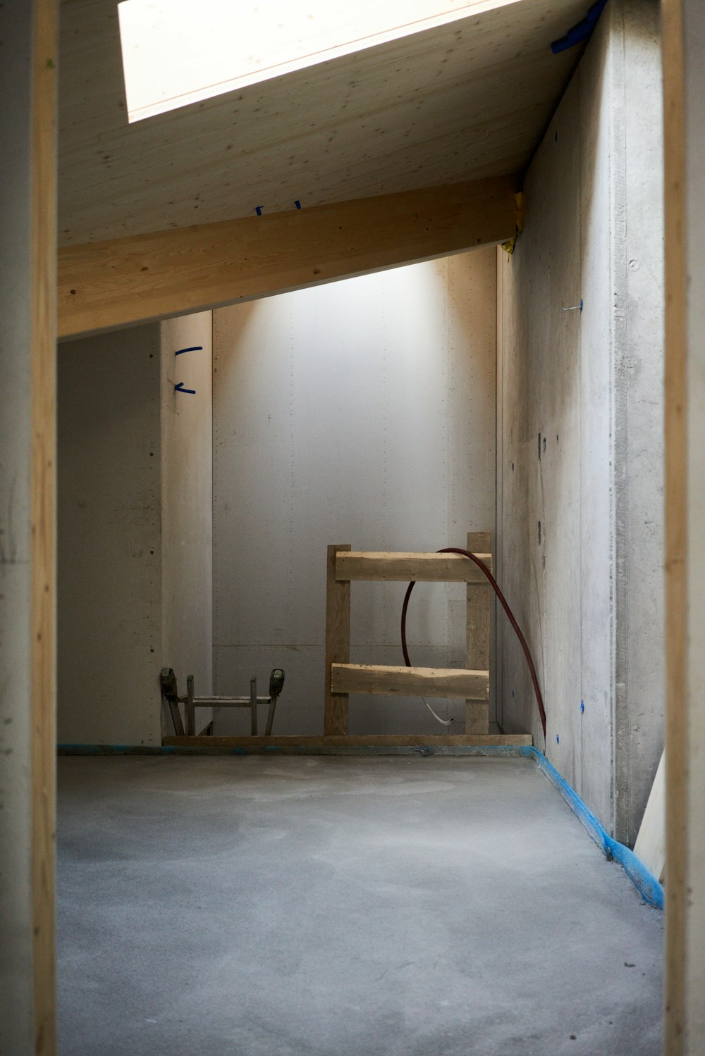 a room that is under construction with a skylight