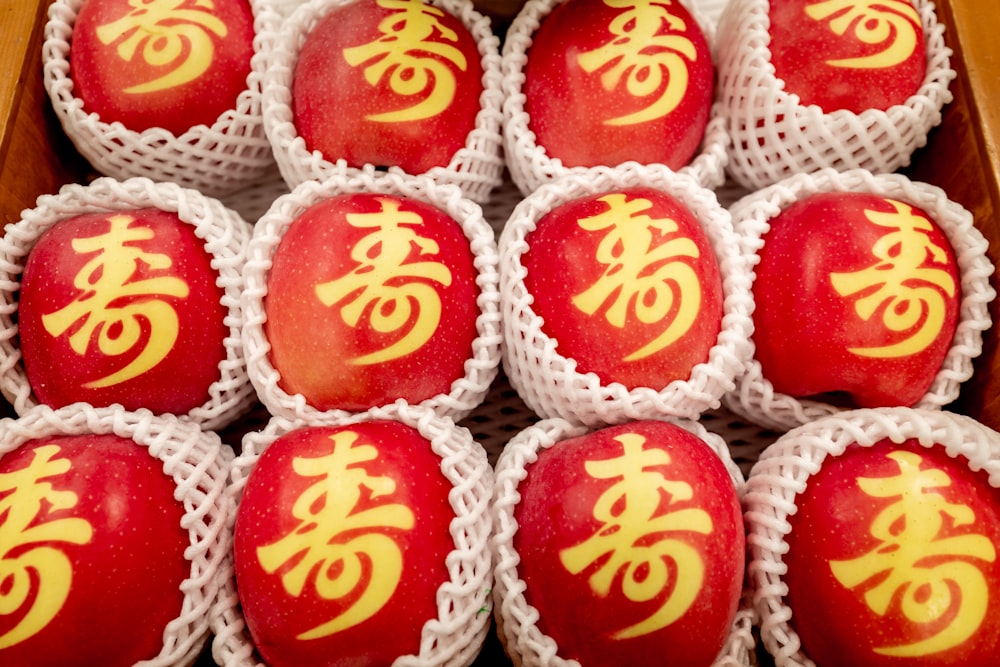 a box filled with red and yellow decorated eggs