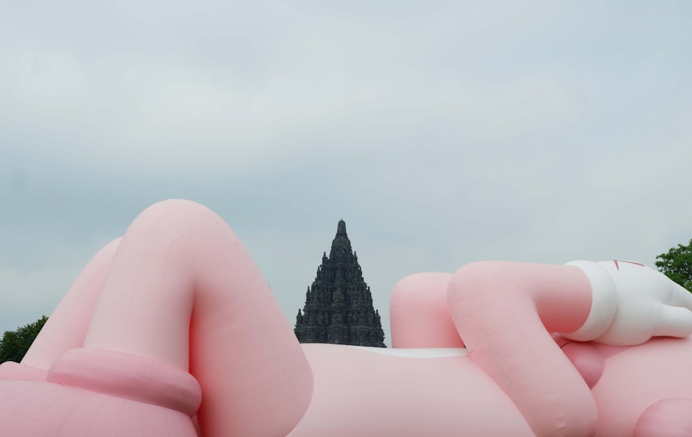 a large inflatable sculpture of a woman laying down