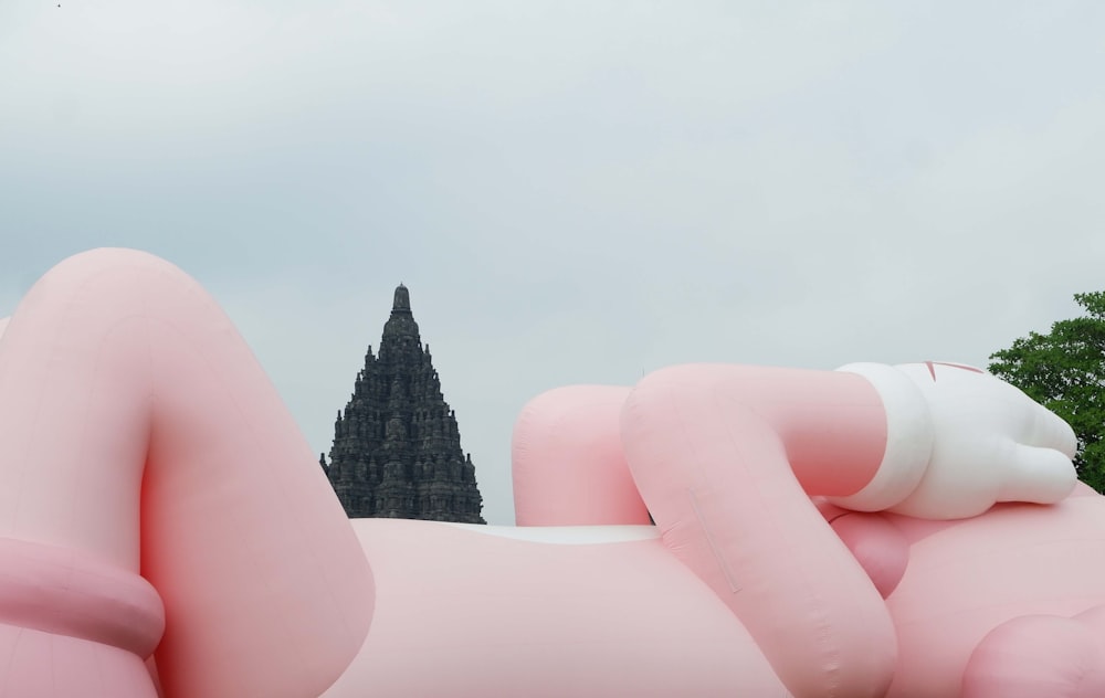 a large inflatable sculpture of a person laying on it's side