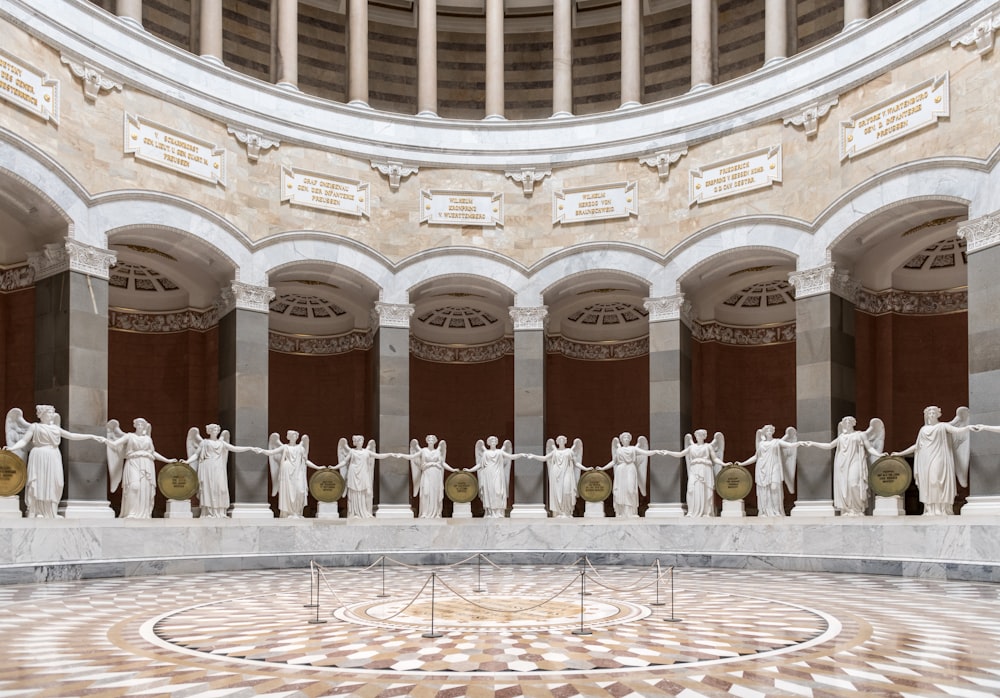 a group of statues in a large room