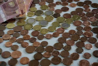 a pile of coins sitting on top of a table