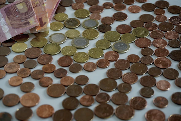 a pile of coins sitting on top of a table