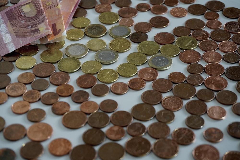 a pile of coins sitting on top of a table