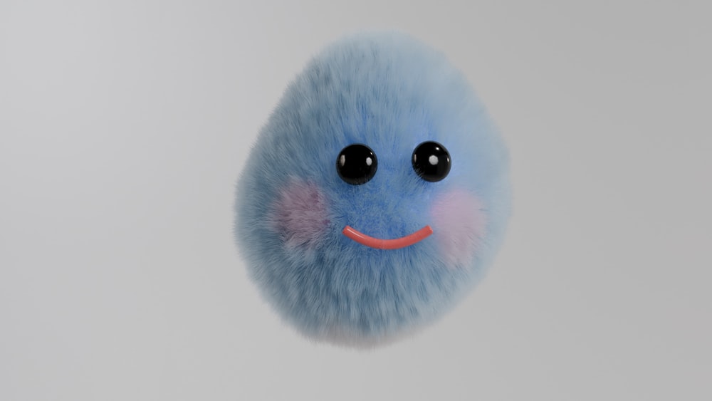 a blue fuzzy ball with a smiley face