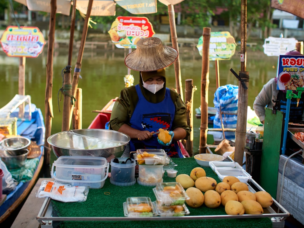 a person sitting at a table with food on it