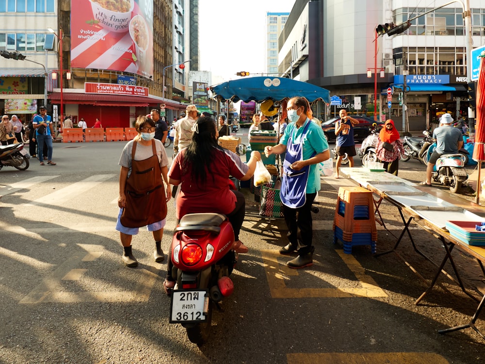 a group of people walking down a street