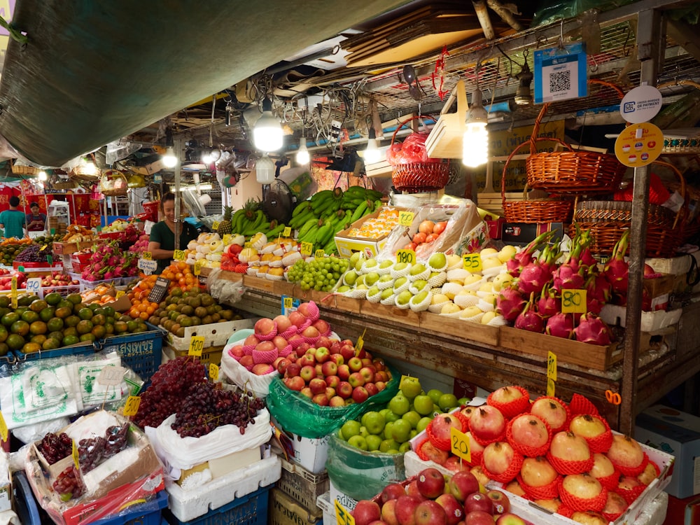 a market filled with lots of fruits and vegetables