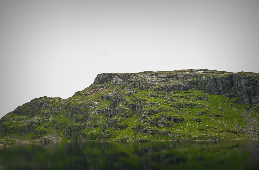 a mountain with a lake in front of it