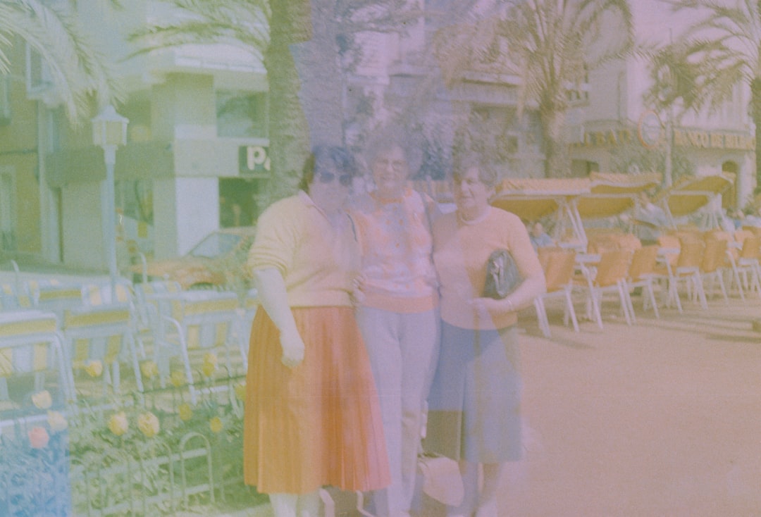 a group of women standing next to each other, Photos from a AGFA Optima 500 camera I bought from a fair with an old film already inside, turned up a nice colour palette.