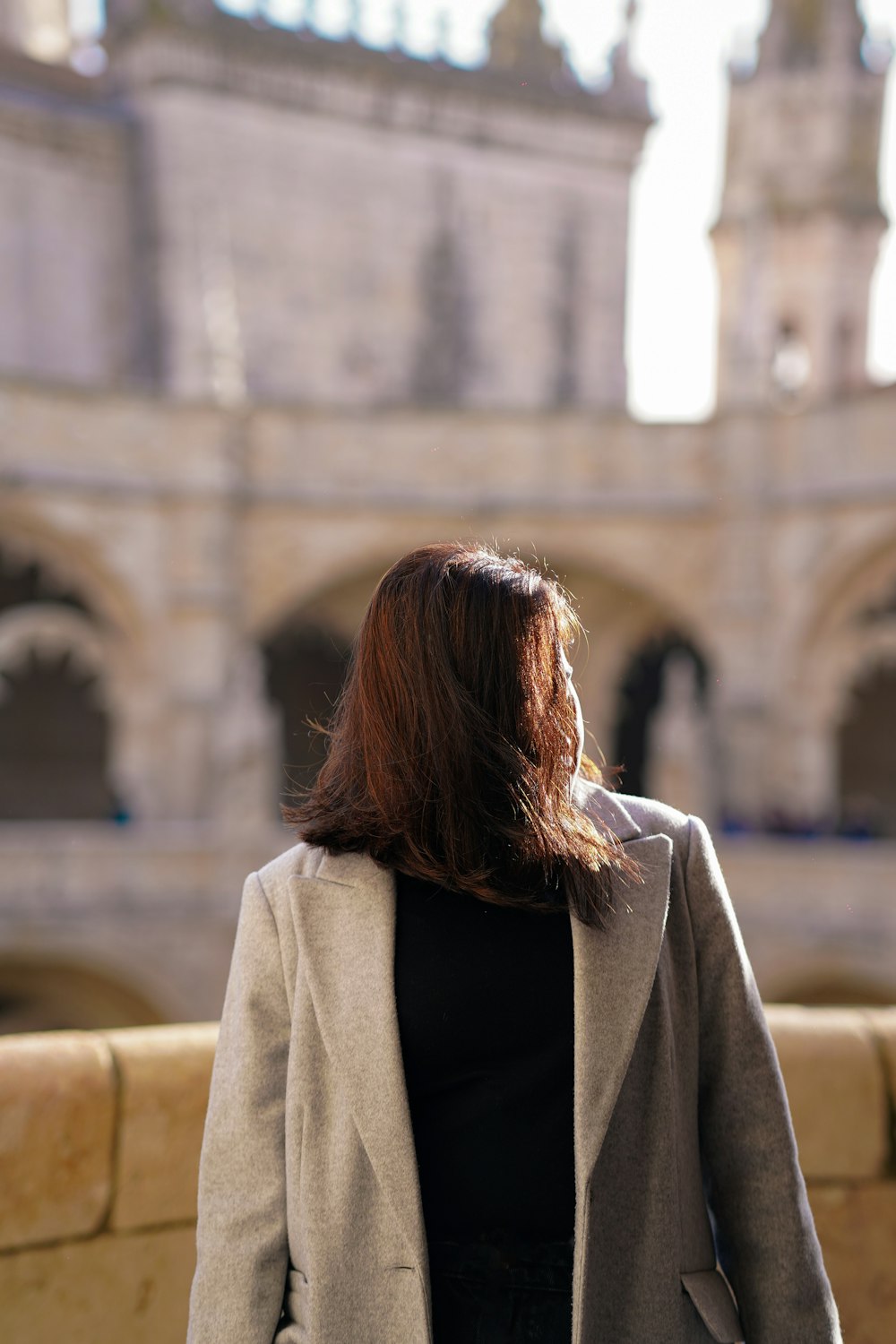 a woman standing in front of a building