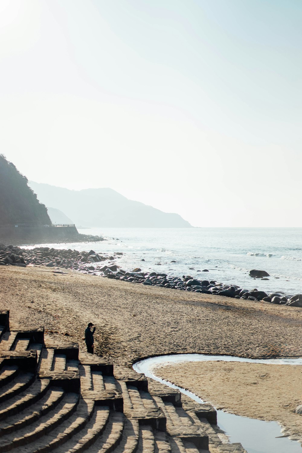 an empty stage on a beach near the ocean