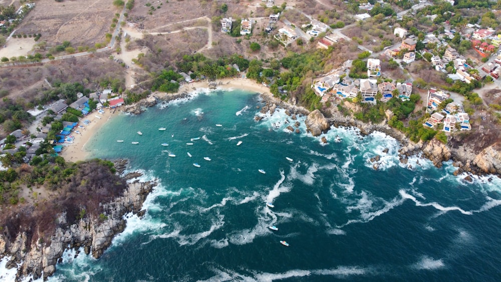 a bird's eye view of the ocean and a small town