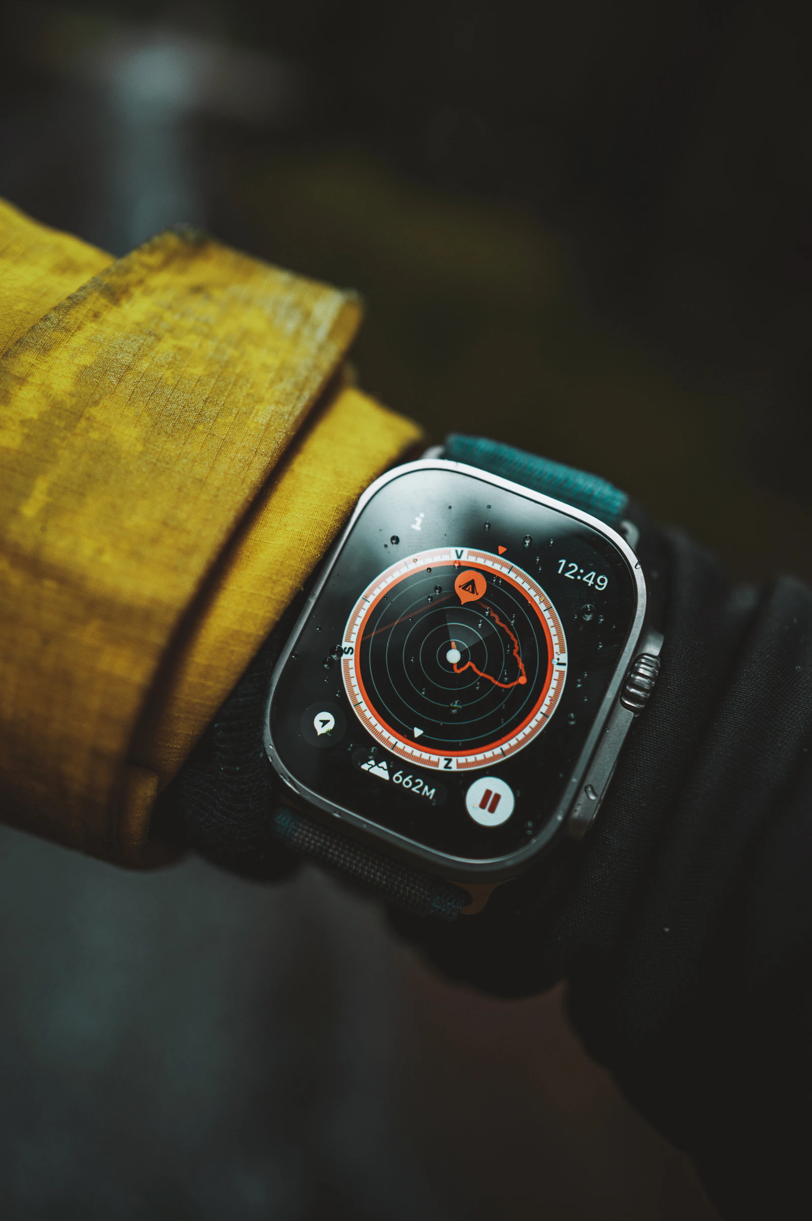 Apple Watch Ultra on wrist, yellow jacket