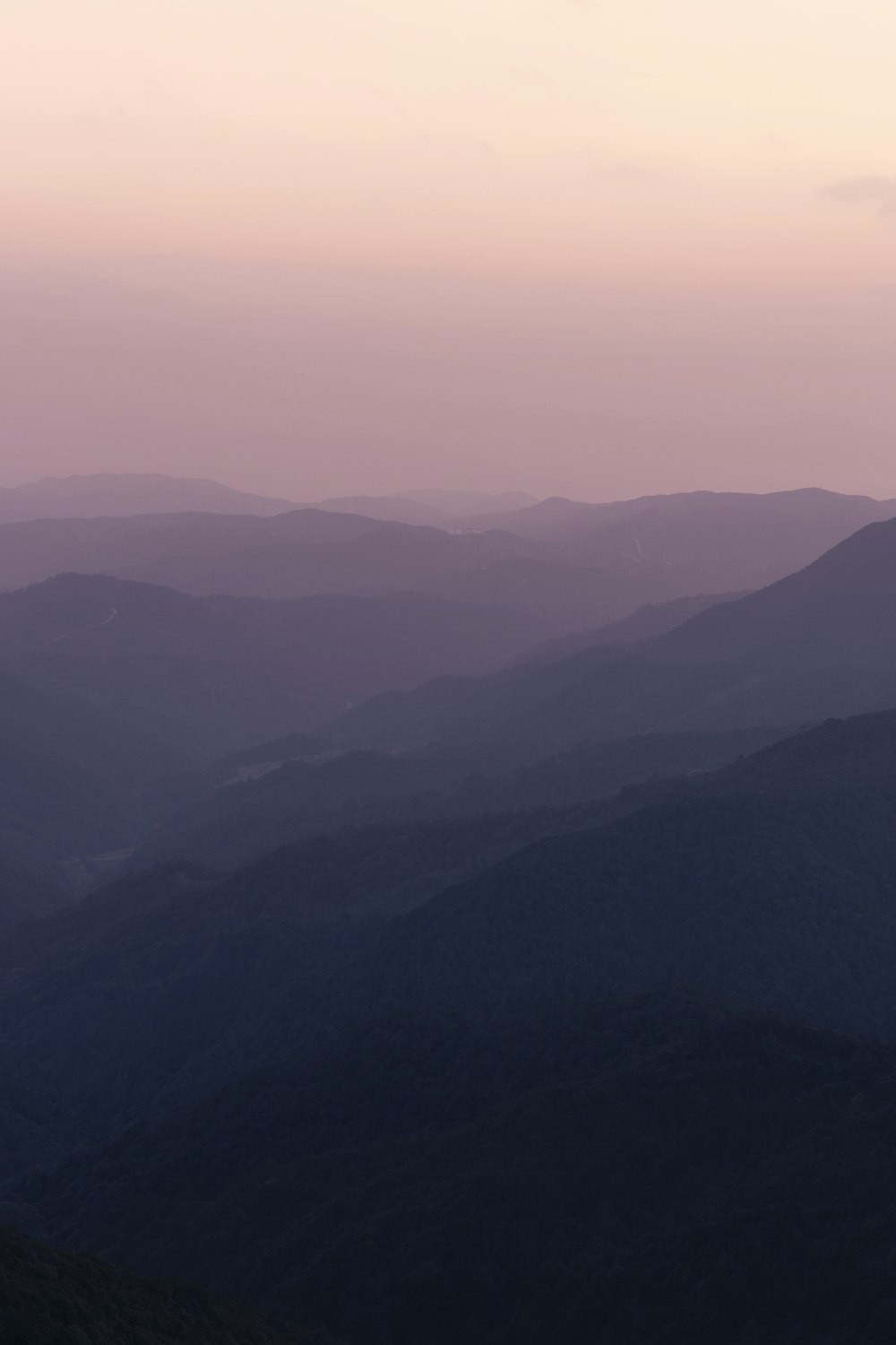 a view of a mountain range at sunset