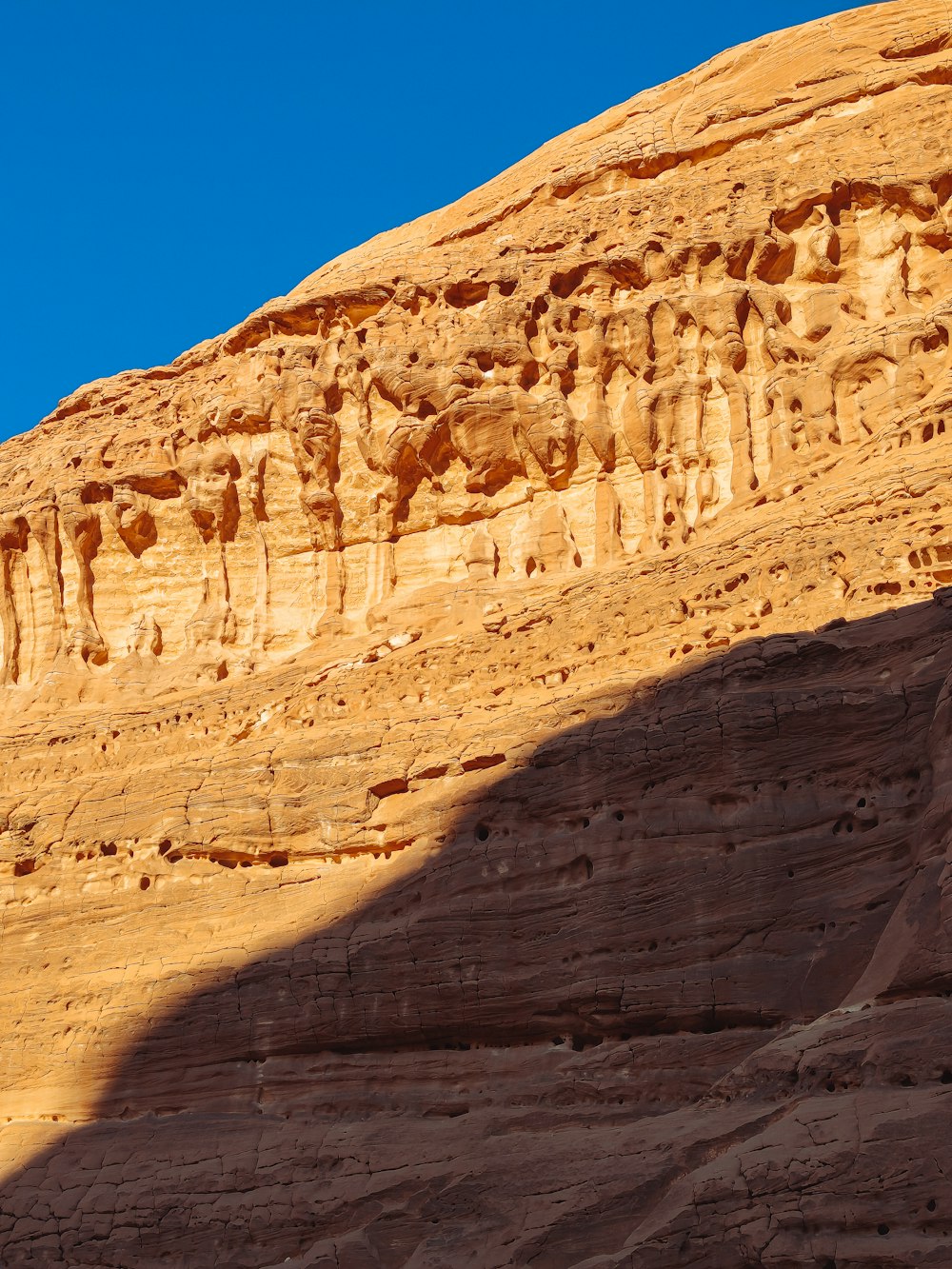 a large rock formation in the middle of a desert