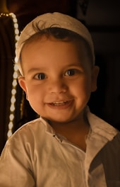 a little boy that is smiling for the camera