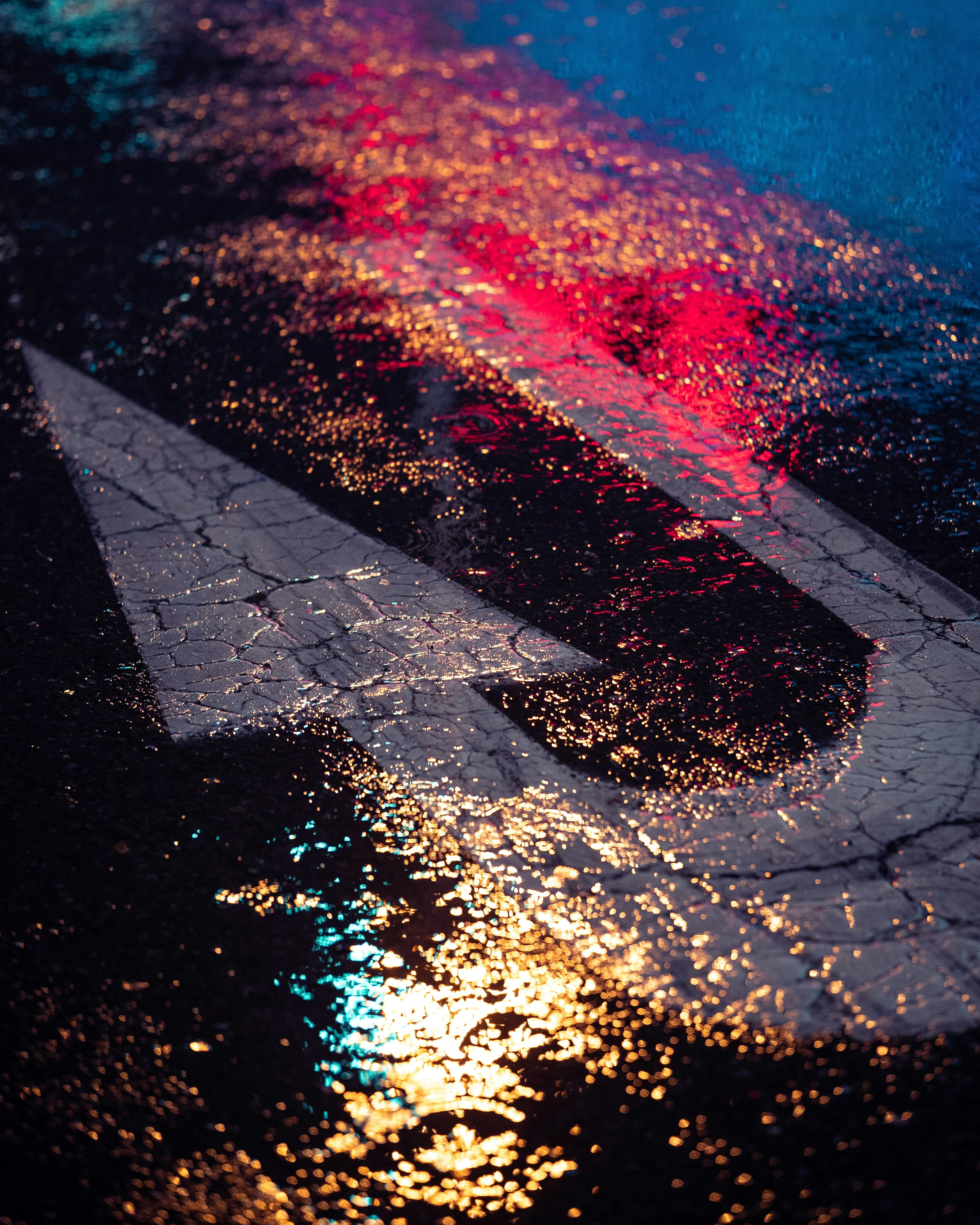 a close up of a street sign on a wet street