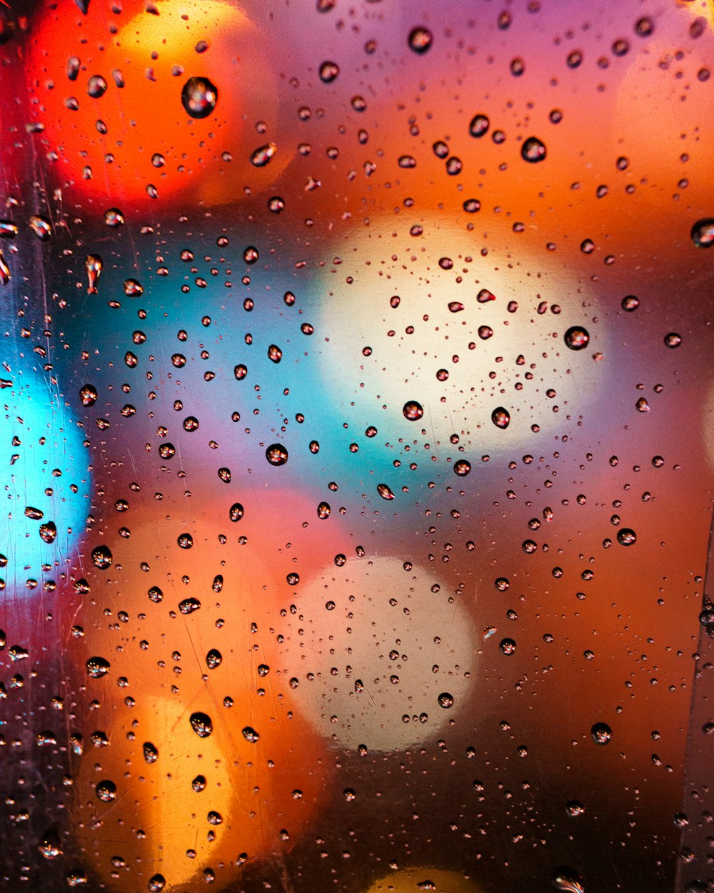 a close up of a window with rain drops