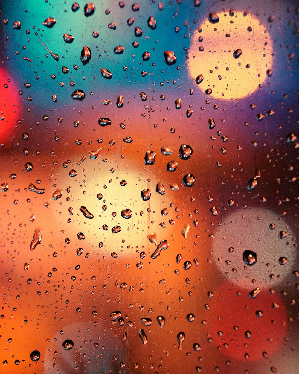 a close up of a window with rain drops