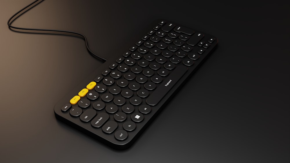 a black and yellow keyboard on a black surface