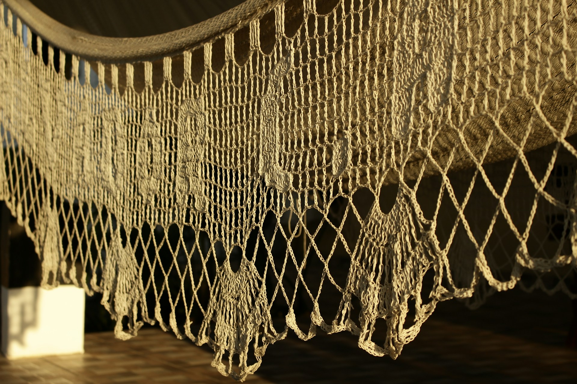 a close up of a bed with a net on top of it