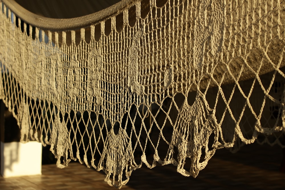a close up of a bed with a net on top of it