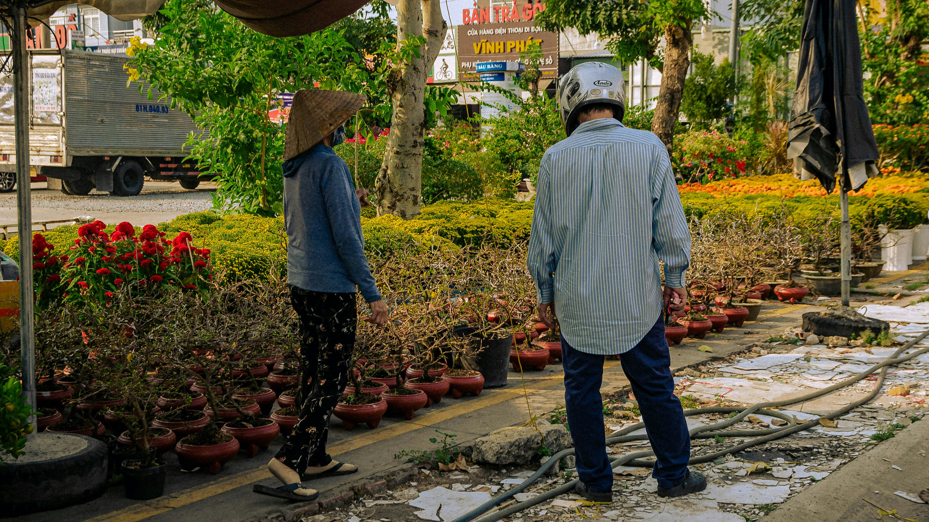a man standing next to a woman in a garden
