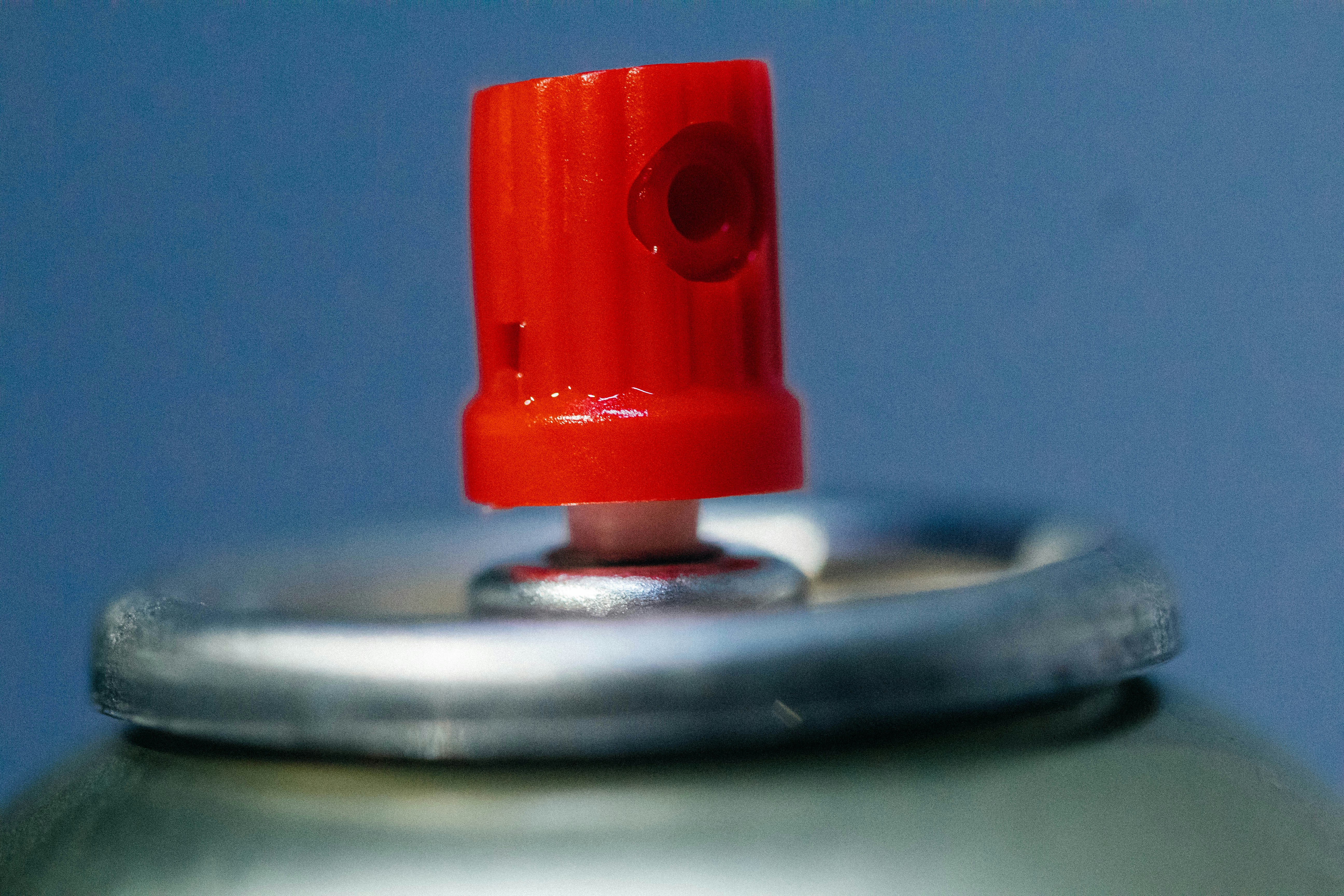 showing a side-by-side comparison of a new capacitor and a visibly bulging, leaking old capacitor - AC compressor capacitor cost