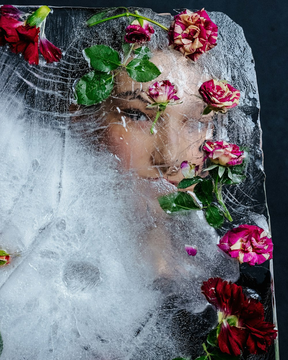 a woman with flowers on her head is covered in ice