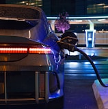 an electric car plugged in to a charging station