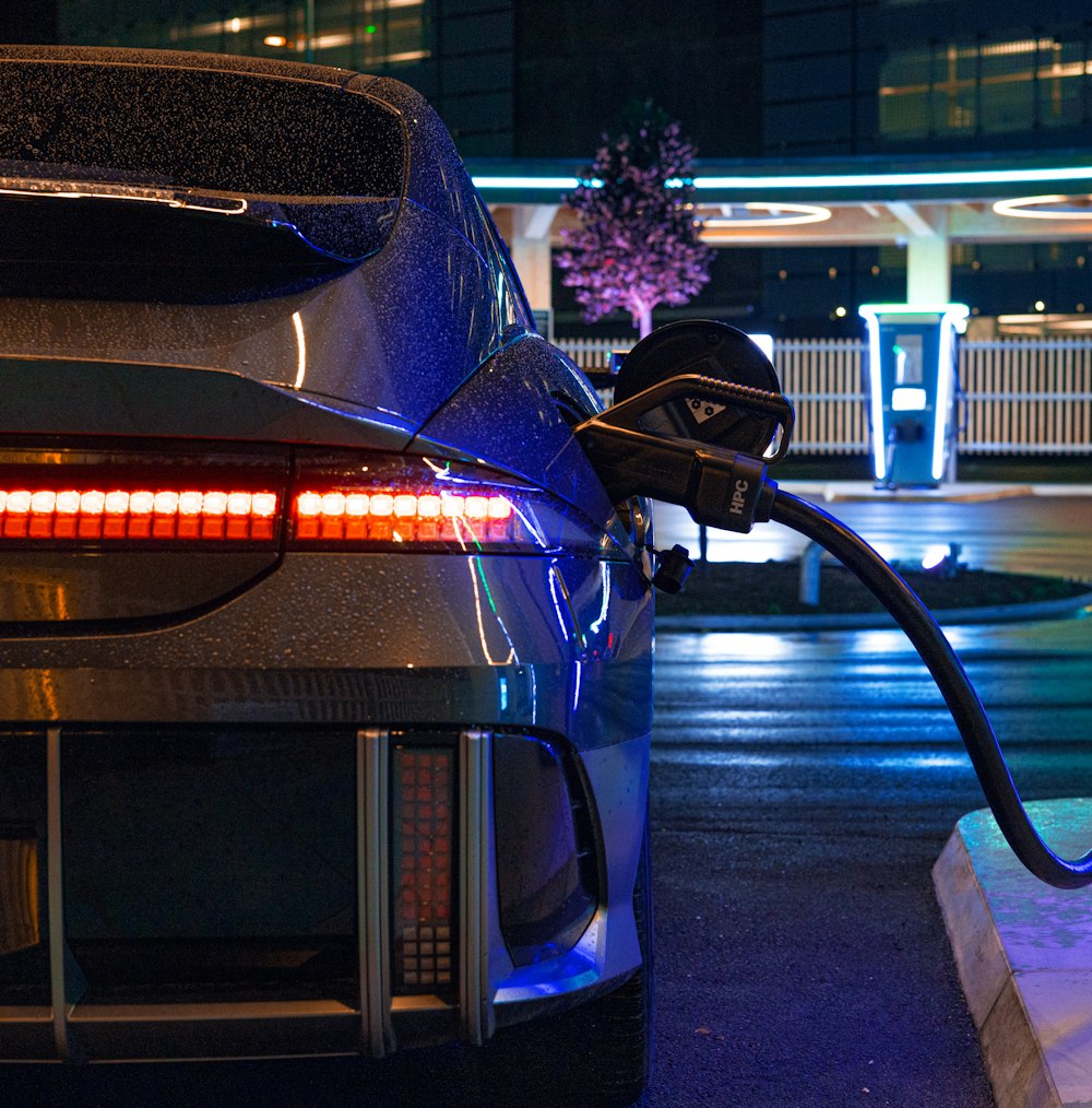 an electric car plugged in to a charging station