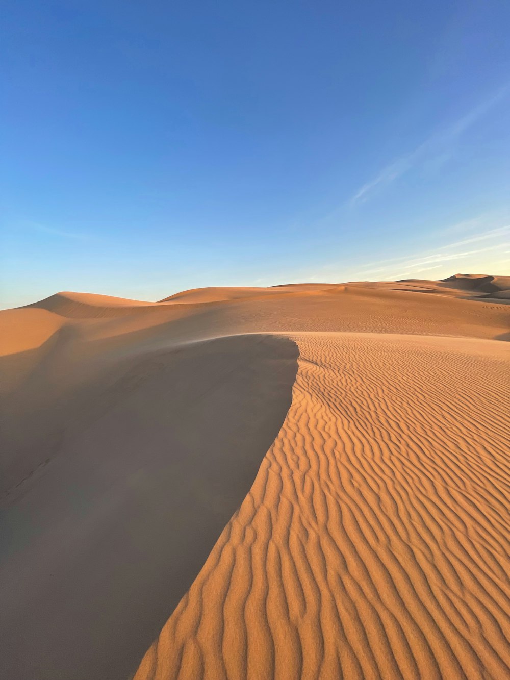 a wide expanse of sand in the middle of a desert