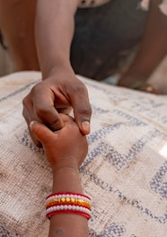 a person holding the hand of another person
