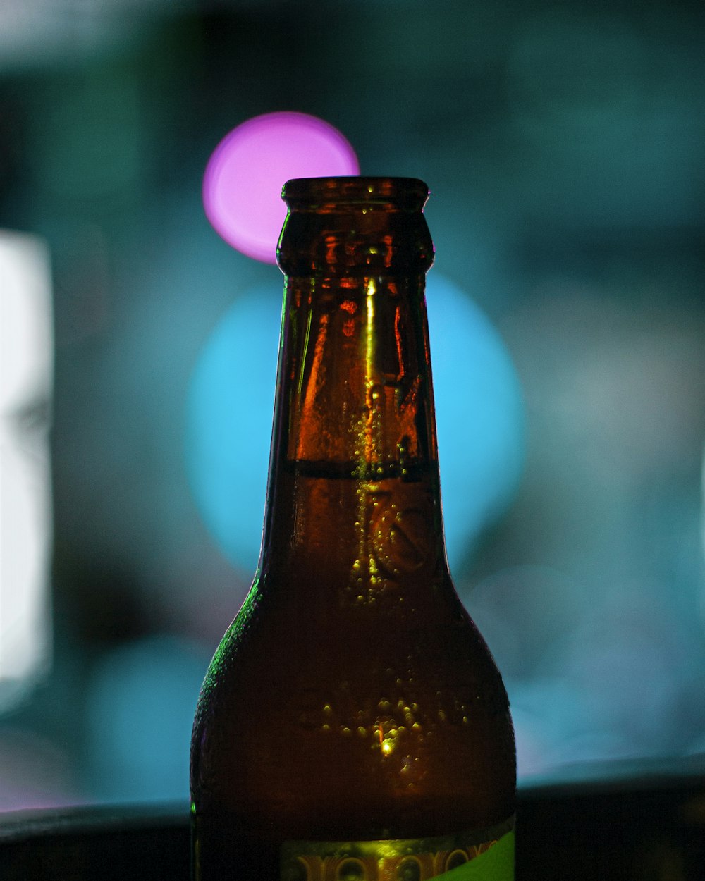 a close up of a beer bottle on a table