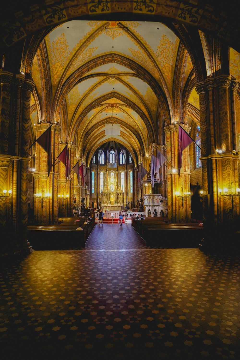 a large cathedral with a checkered floor and vaulted ceiling