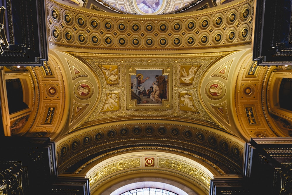 the ceiling of a building with a painting on it