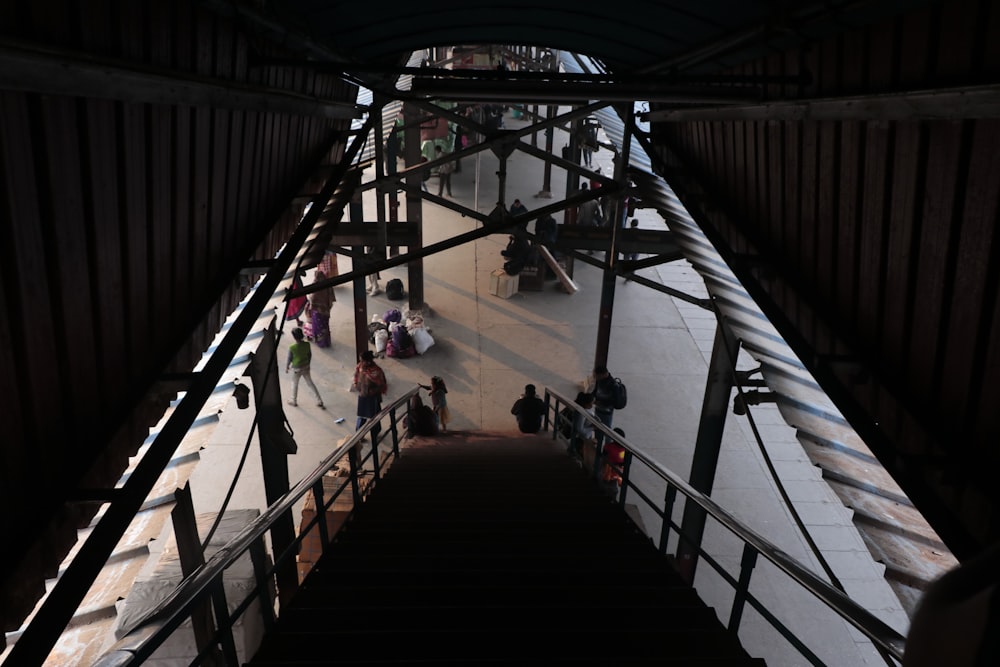 a group of people walking up and down a flight of stairs