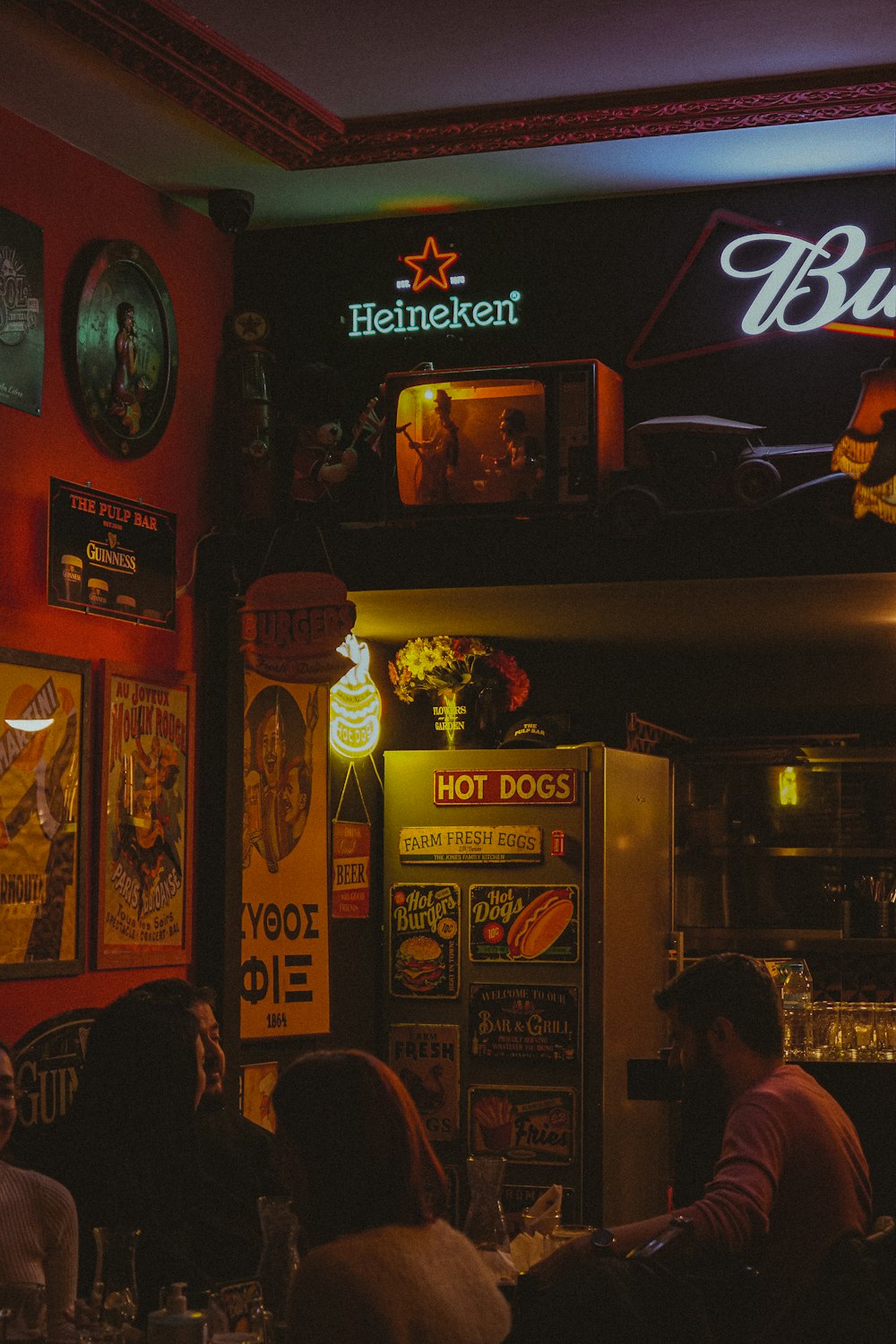 a group of people sitting around a bar