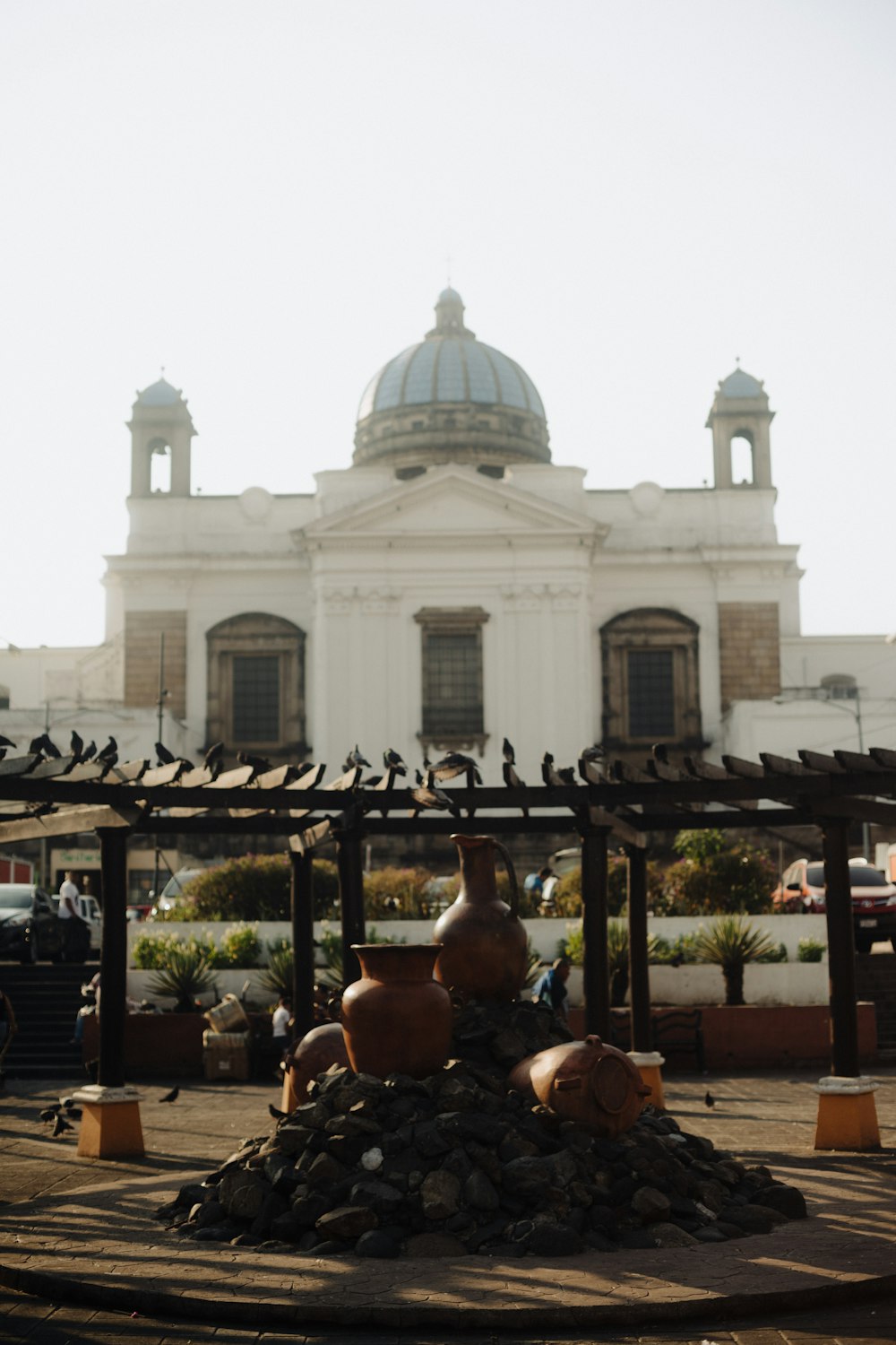 a large building with a lot of birds on top of it