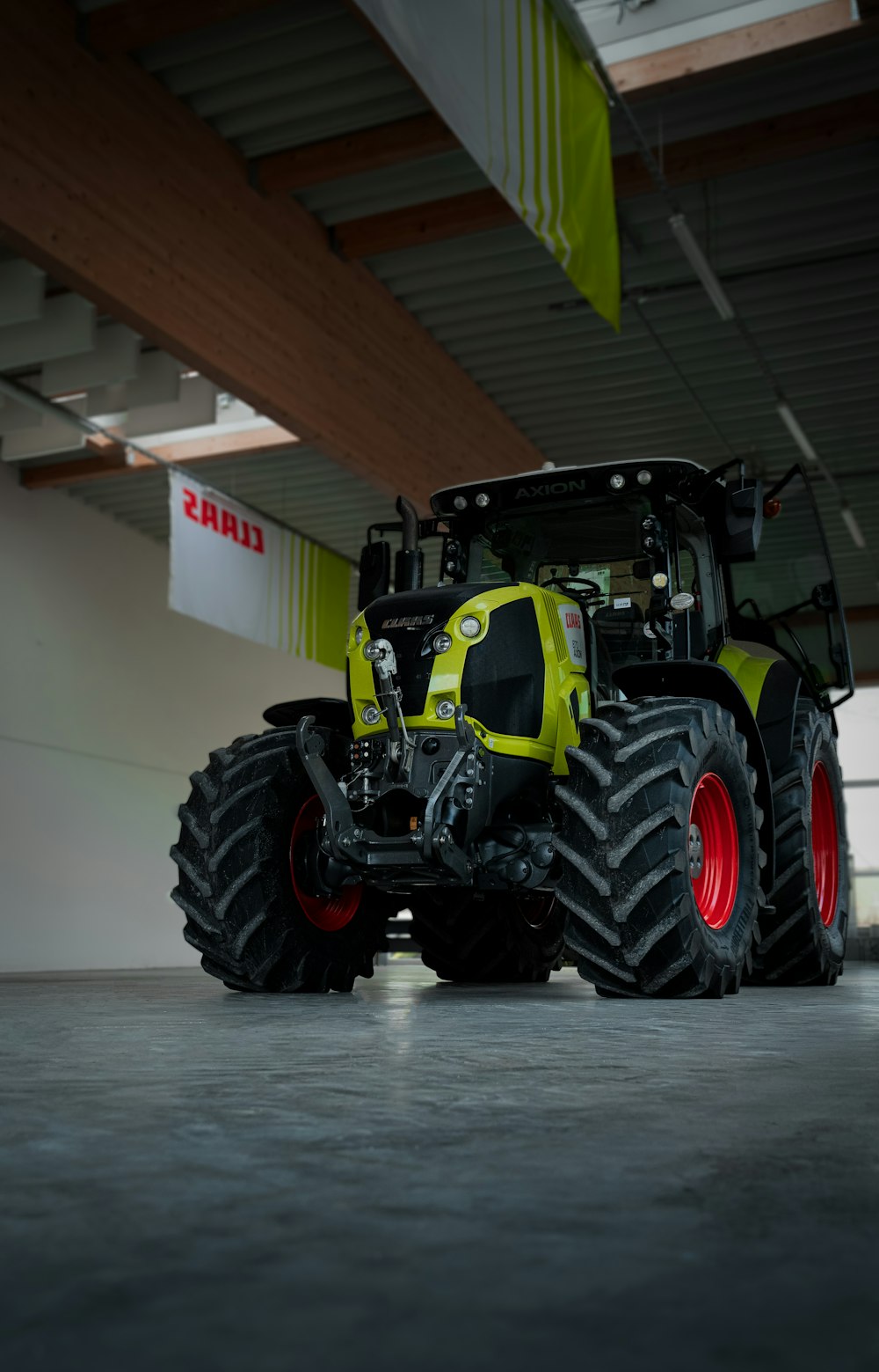 a large tractor parked inside of a garage