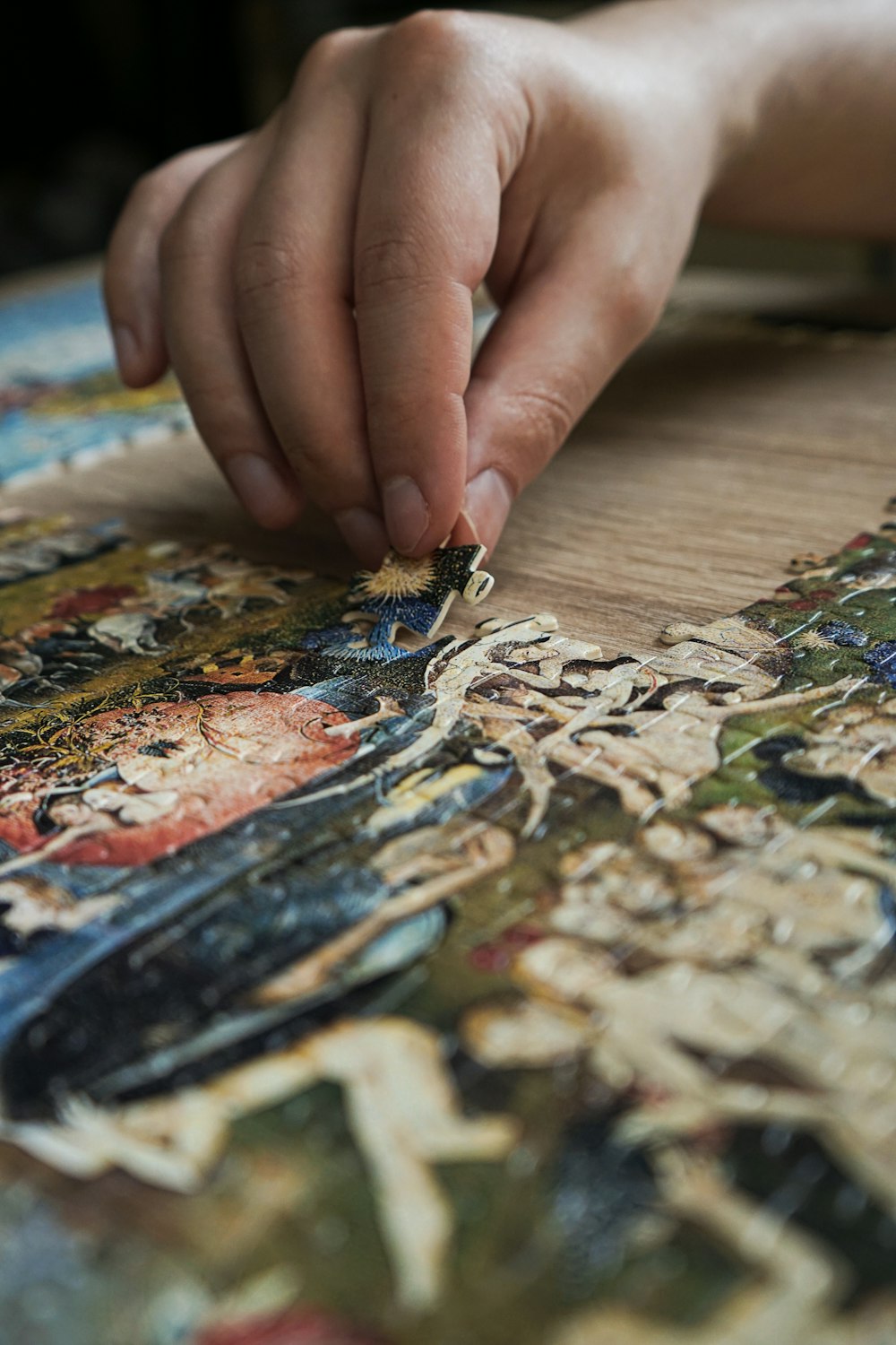 a close up of a person working on a piece of art