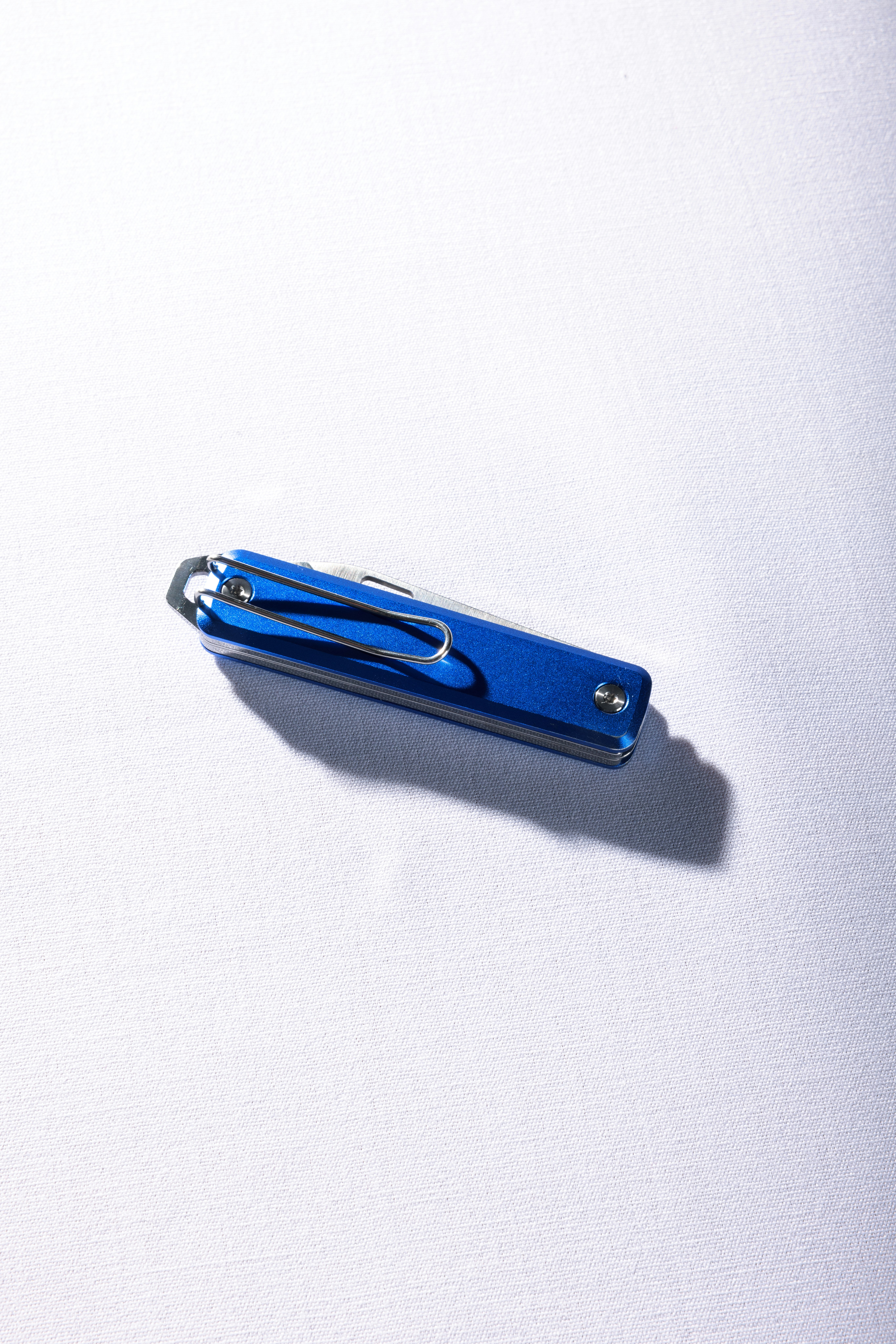 a pair of scissors sitting on top of a white surface