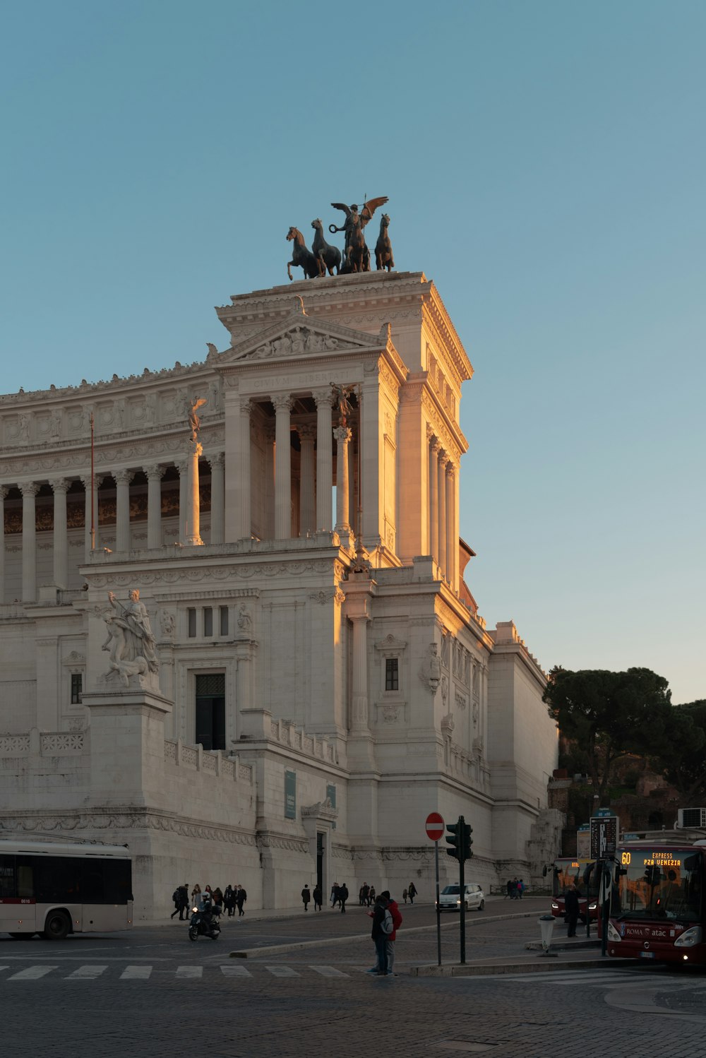 a large building with statues on top of it